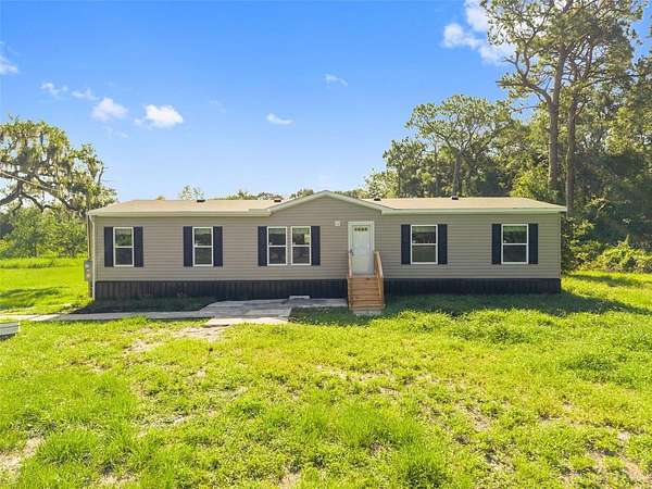 2.5 Acres of Land with Home for Sale in Spring Hill, Florida
