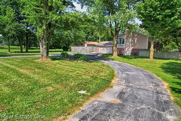 3 Acres of Land with Home for Sale in Salem Township, Michigan