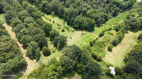 27.6 Acres of Land for Sale in Hollow Rock, Tennessee