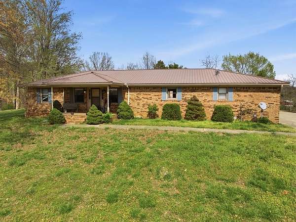 10.7 Acres of Recreational Land with Home for Sale in Nortonville, Kentucky