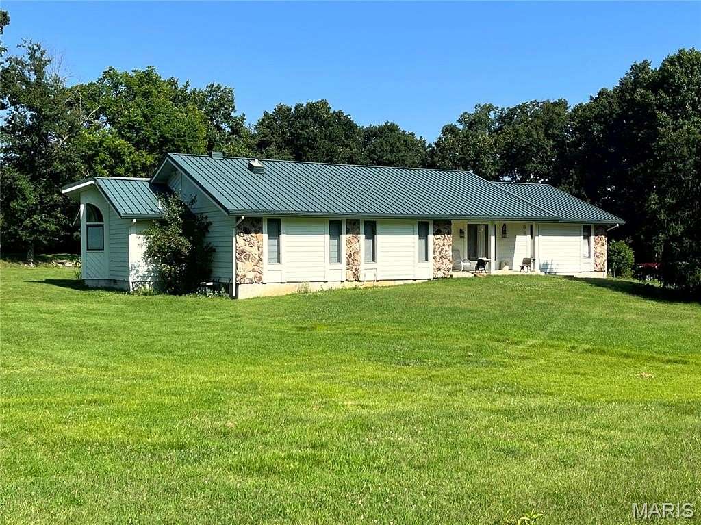 7.49 Acres of Land with Home for Auction in Defiance, Missouri
