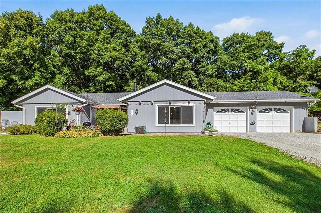 1.55 Acres of Land with Home for Sale in Oak Grove, Missouri