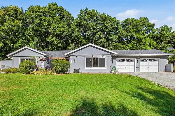 1.55 Acres of Land with Home for Sale in Oak Grove, Missouri