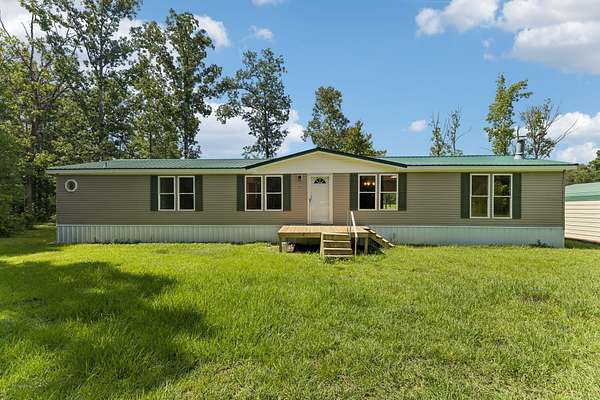 1.5 Acres of Land with Home for Sale in Hohenwald, Tennessee
