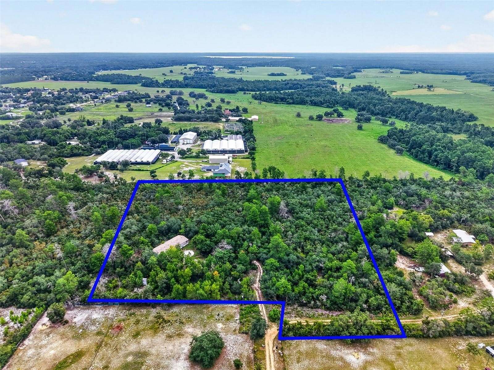 7.36 Acres of Land with Home for Sale in Umatilla, Florida