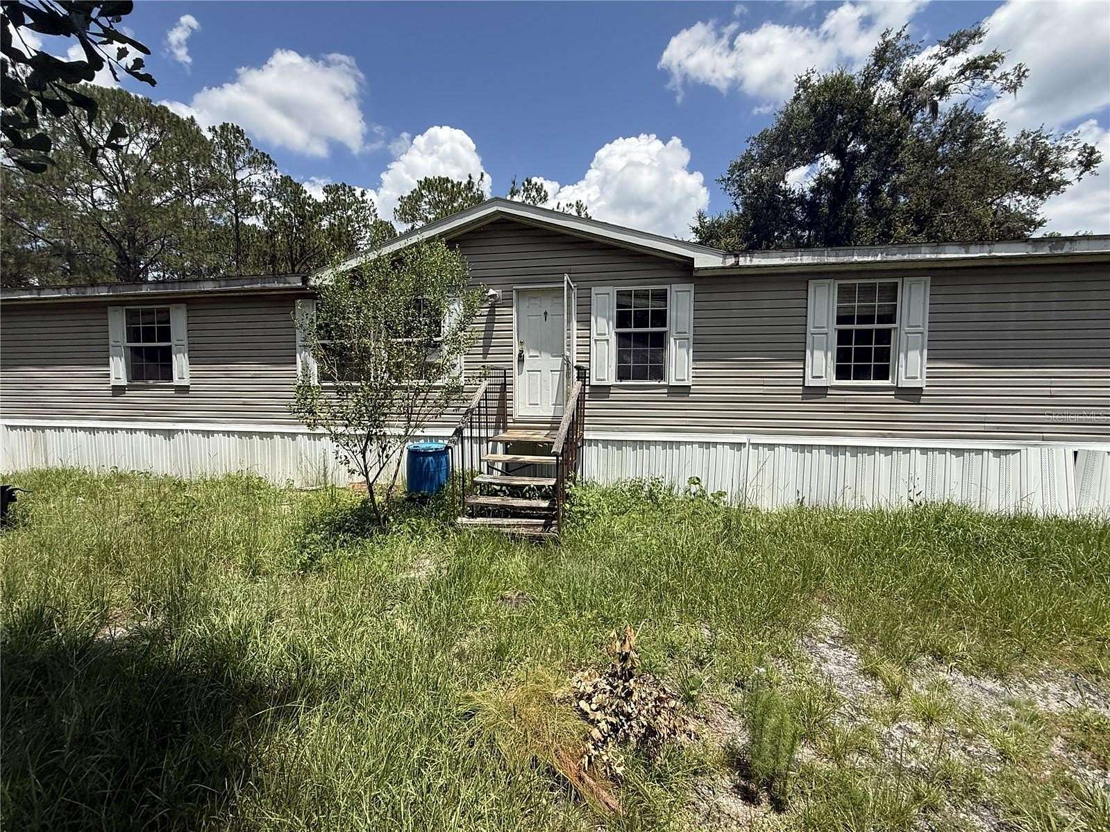 5 Acres of Land with Home for Sale in Lakeland, Florida