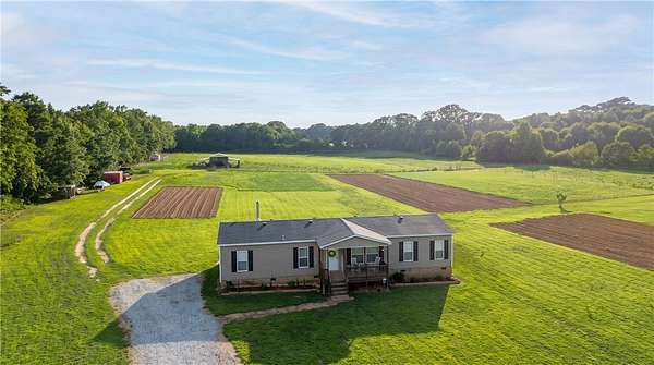 11.4 Acres of Land with Home for Sale in Starr, South Carolina