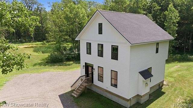 5.89 Acres of Land with Home for Sale in Handy Township, Michigan