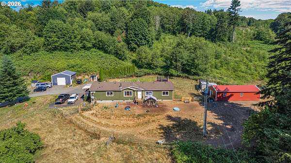 7.63 Acres of Land with Home for Sale in Rainier, Oregon