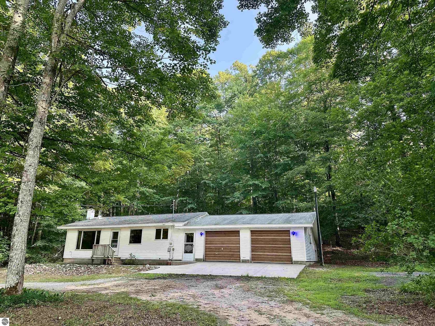 10 Acres of Land with Home for Sale in Cedar, Michigan