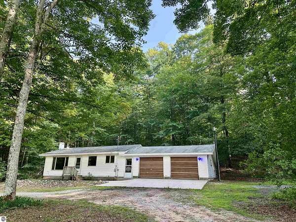 10 Acres of Land with Home for Sale in Cedar, Michigan