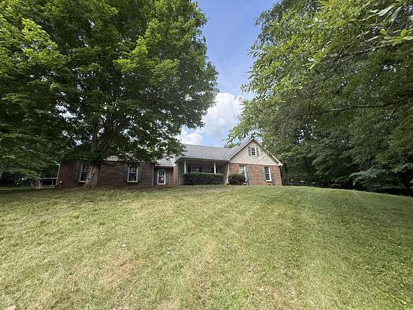 6.7 Acres of Land with Home for Sale in Woodlawn, Tennessee