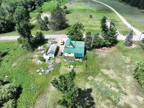 1.5 Acres of Land with Home for Sale in Vanderbilt, Michigan
