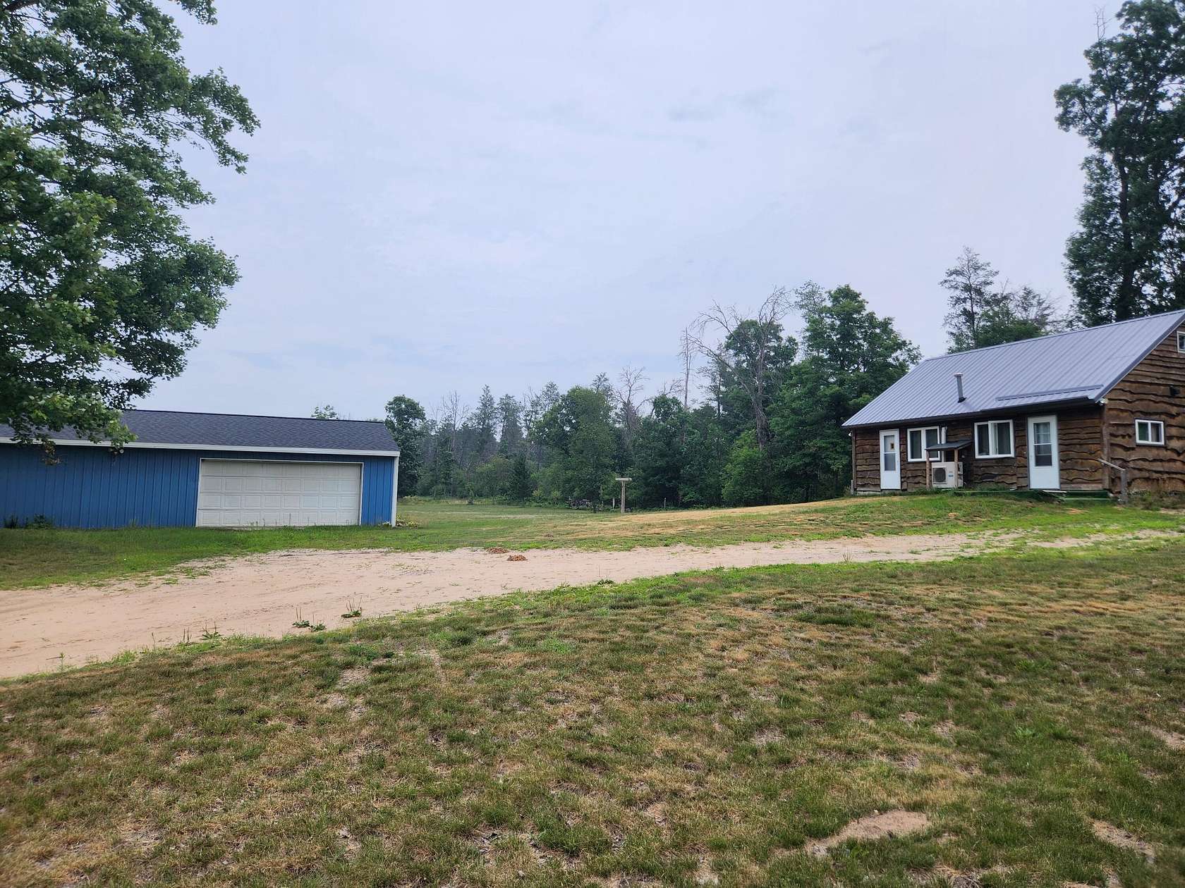 10 Acres of Land with Home for Sale in Irons, Michigan