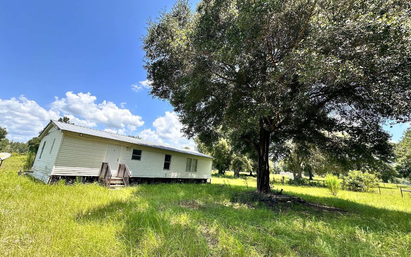 9.8 Acres of Land with Home for Sale in Fort White, Florida