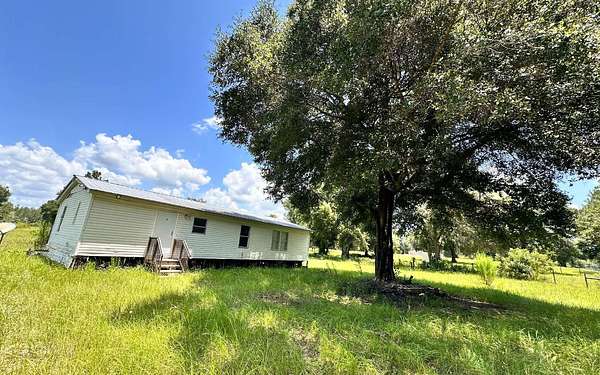 9.8 Acres of Land with Home for Sale in Fort White, Florida