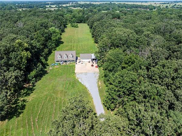 8.4 Acres of Land with Home for Sale in Gentry, Arkansas