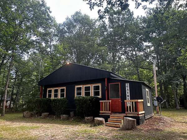 2 Acres of Land with Home for Sale in Irons, Michigan