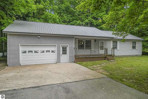 9.3 Acres of Land with Home for Sale in Interlochen, Michigan