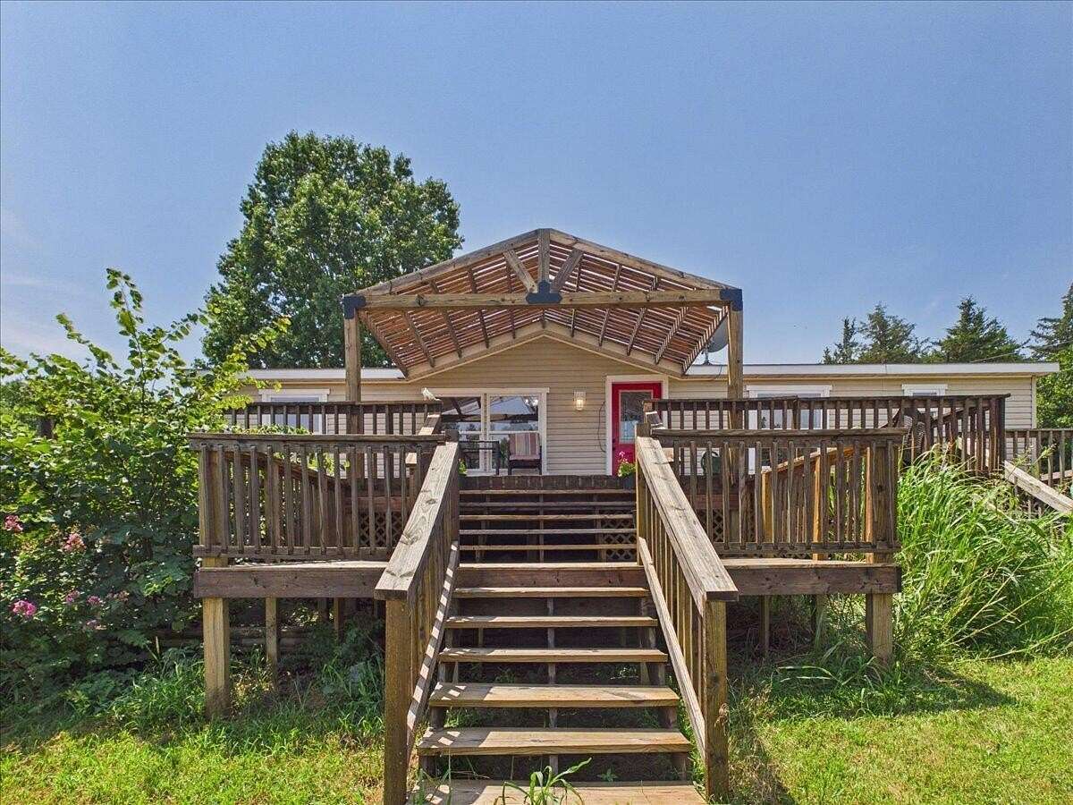5 Acres of Land with Home for Sale in Wheatland, Missouri