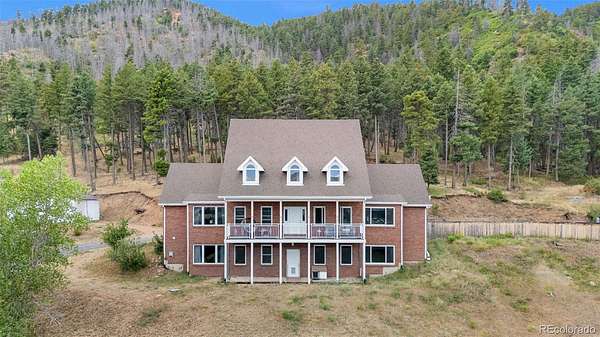 10.4 Acres of Recreational Land with Home for Sale in Larkspur, Colorado