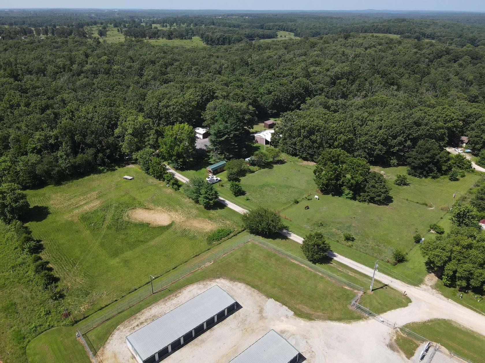 5.25 Acres of Land with Home for Sale in Pomona, Missouri