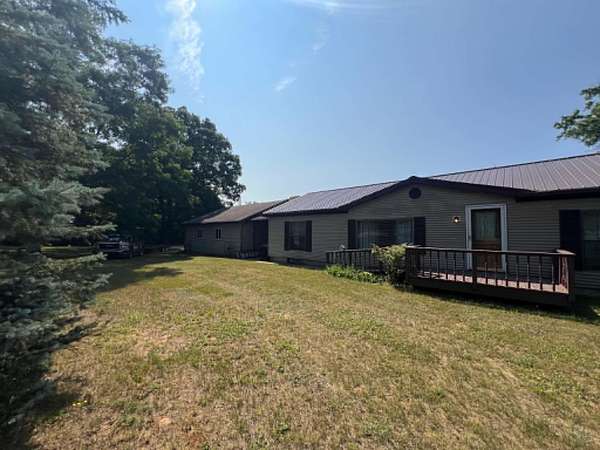 7.5 Acres of Land with Home for Sale in Harrison, Michigan