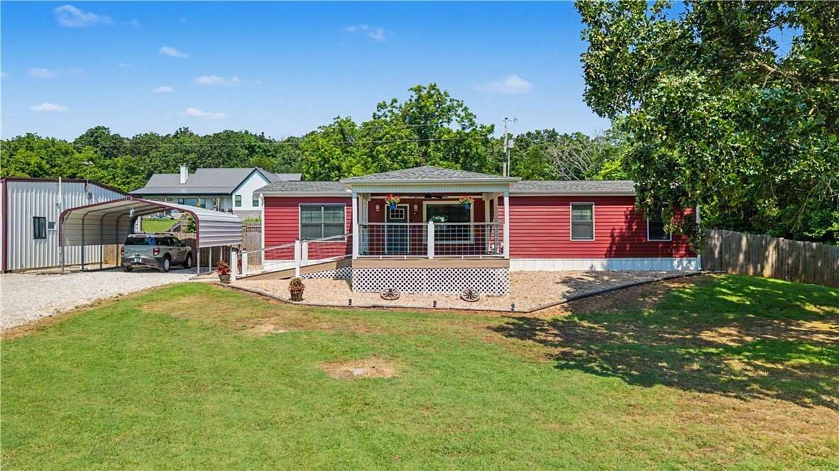 3.86 Acres of Land with Home for Sale in Garfield, Arkansas
