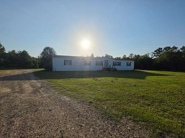11.8 Acres of Land with Home for Sale in Dubberly, Louisiana
