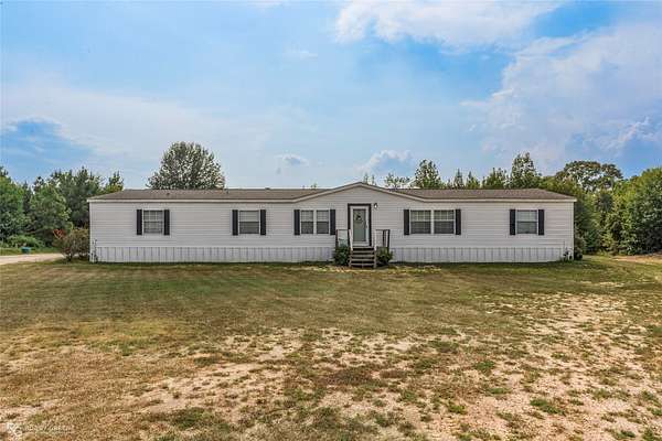 11.8 Acres of Land with Home for Sale in Dubberly, Louisiana