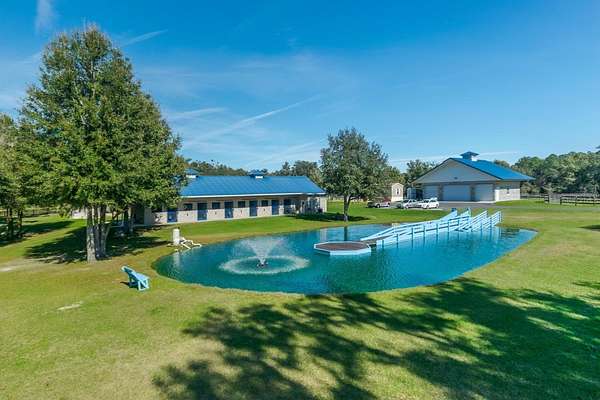 49.4 Acres of Agricultural Land with Home for Sale in Morriston, Florida