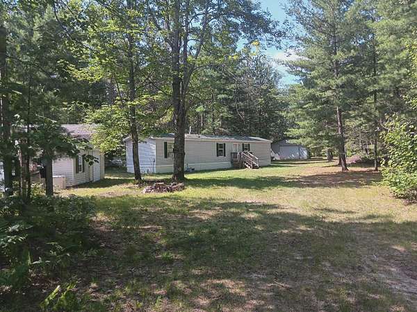 21 Acres of Recreational Land with Home for Sale in Vanderbilt, Michigan