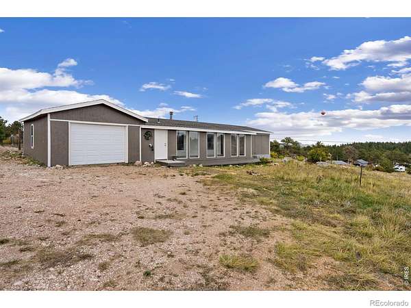 2.39 Acres of Land with Home for Sale in Red Feather Lakes, Colorado
