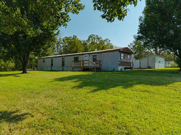 4.5 Acres of Land with Home for Sale in Halfway, Missouri
