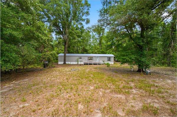 6.6 Acres of Land with Home for Sale in O'Brien, Florida