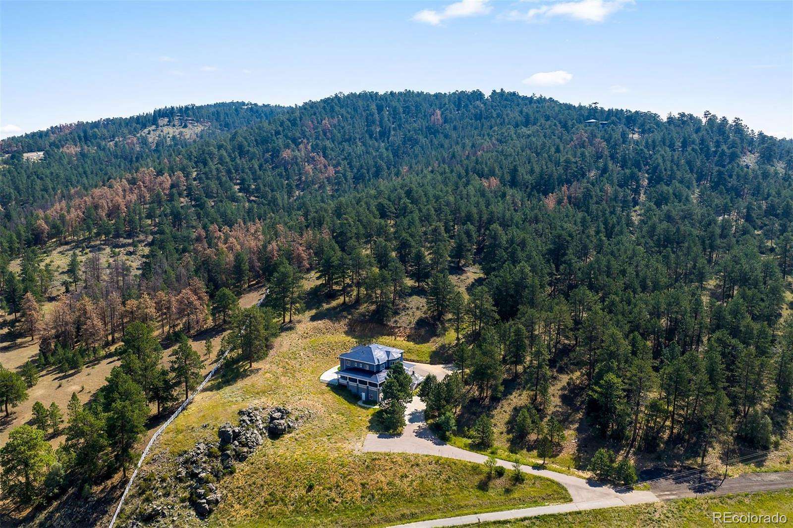 10.1 Acres of Recreational Land with Home for Sale in Evergreen, Colorado