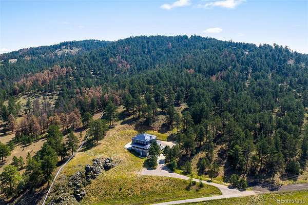 10.1 Acres of Recreational Land with Home for Sale in Evergreen, Colorado