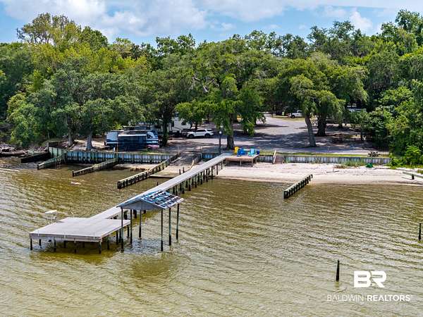 2.54 Acres of Land with Home for Auction in Gulf Shores, Alabama