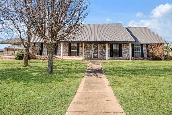 5 Acres of Land with Home for Sale in Paris, Texas