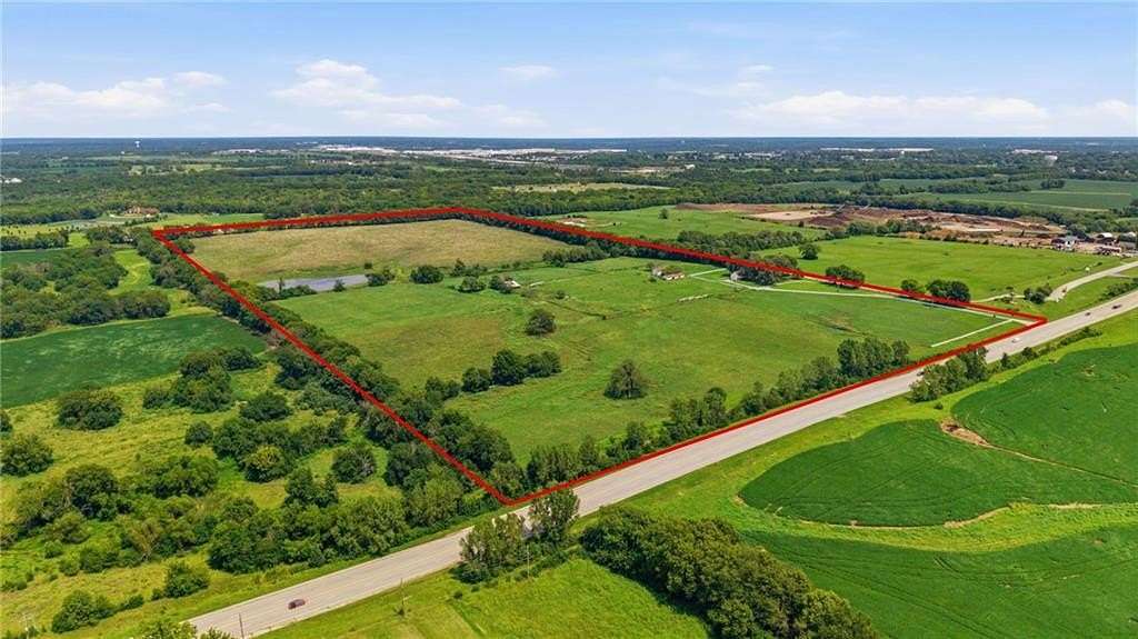 80 Acres of Agricultural Land with Home for Sale in Belton, Missouri