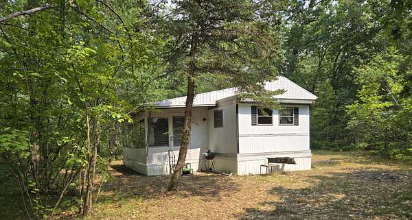 5 Acres of Land with Home for Sale in Chase, Michigan