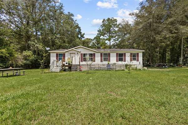 9.58 Acres of Land with Home for Sale in Fort White, Florida