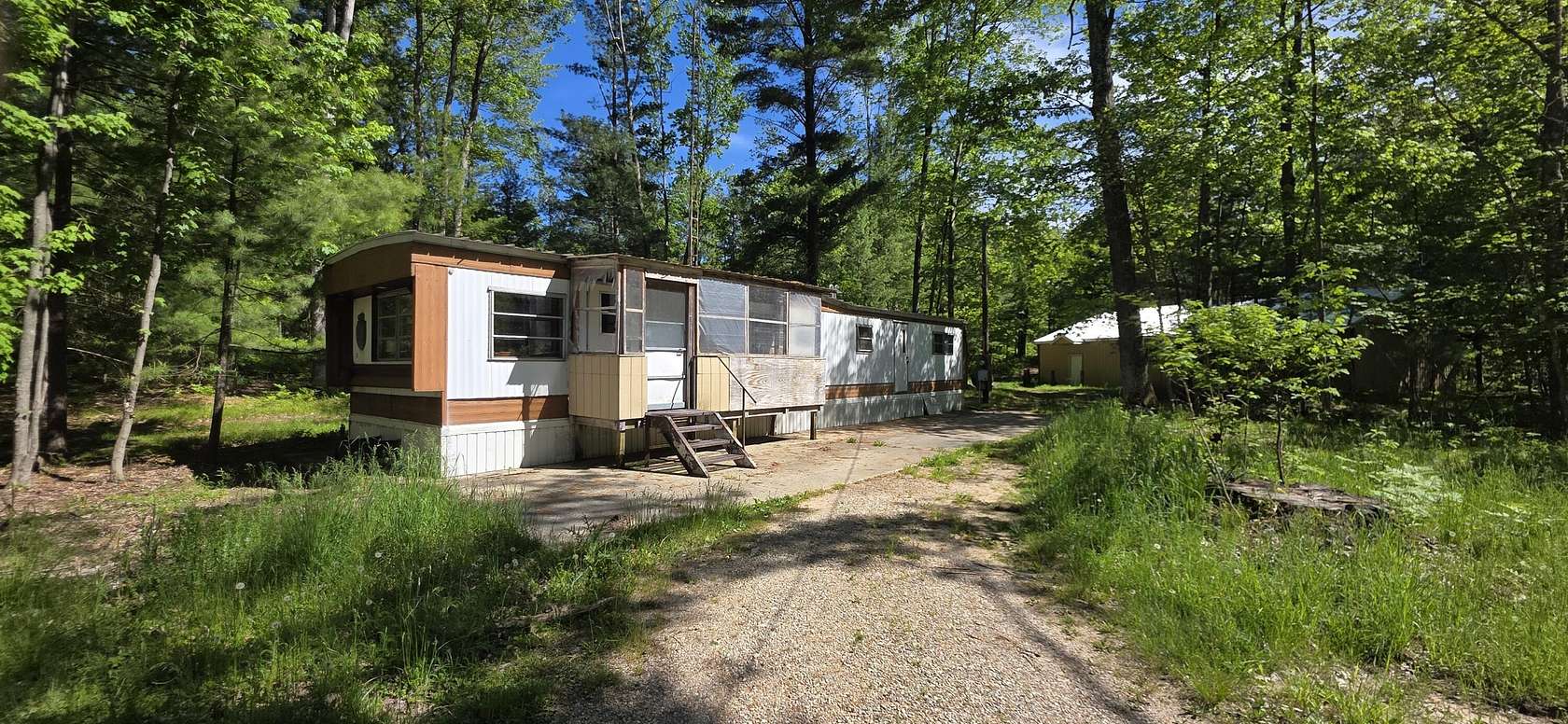 10 Acres of Recreational Land with Home for Sale in Free Soil, Michigan