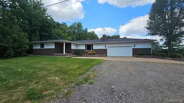 10 Acres of Land with Home for Sale in Hamburg Township, Michigan
