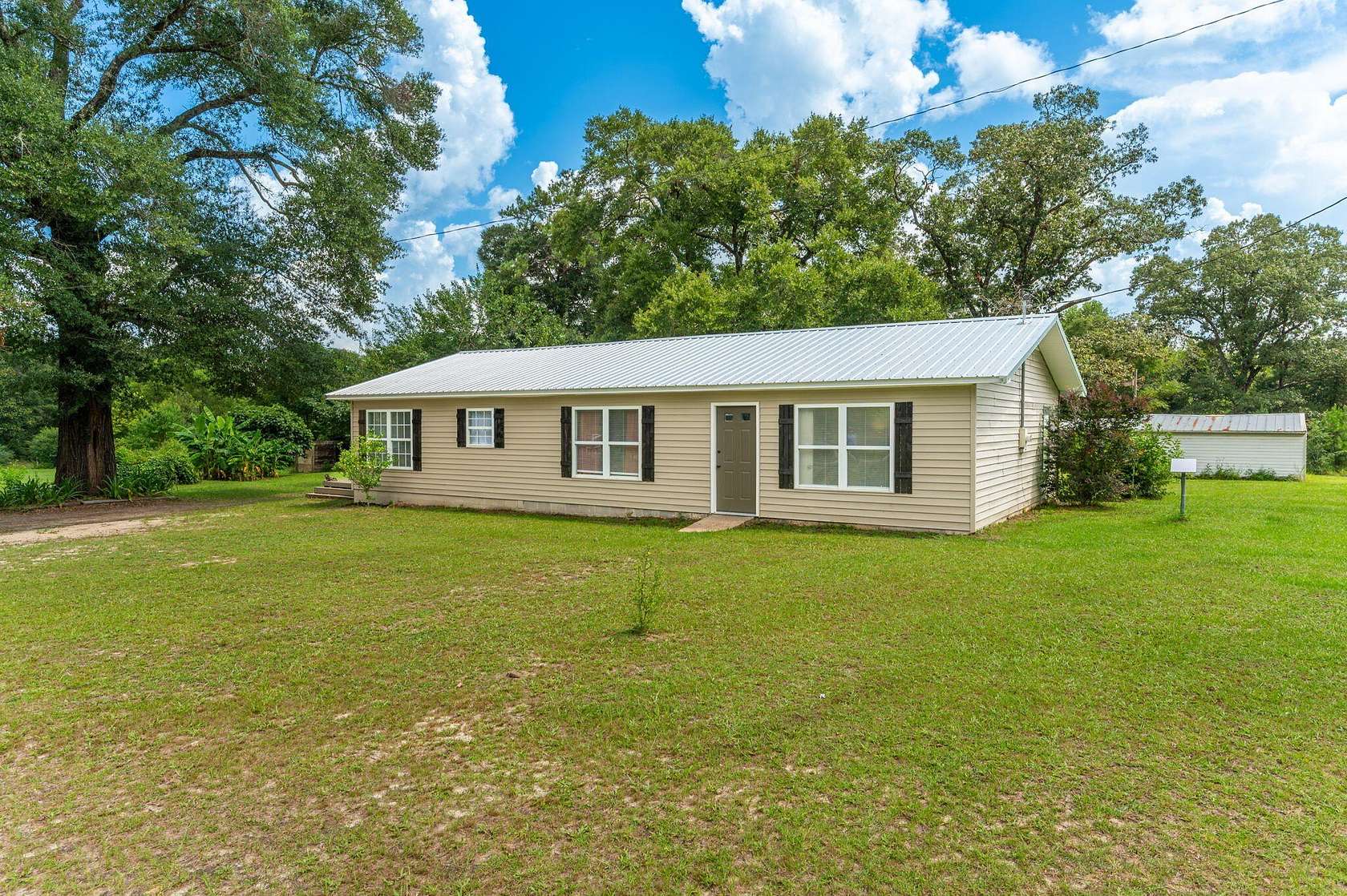 4.66 Acres of Land with Home for Sale in Laurel Hill, Florida