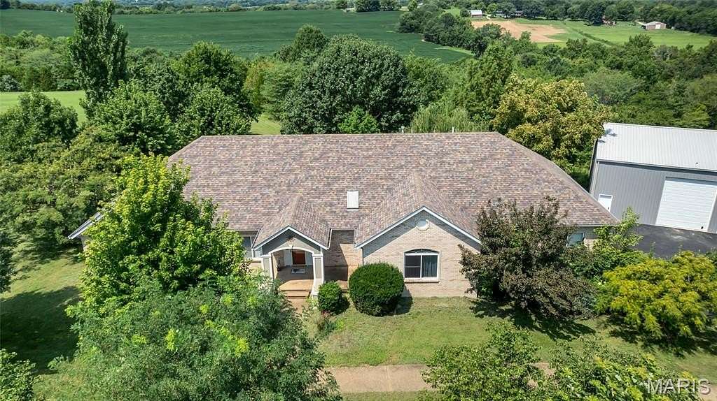5 Acres of Land with Home for Sale in St. Johns Township, Missouri