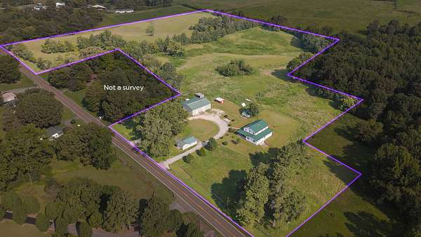 29.2 Acres of Agricultural Land with Home for Sale in McKenzie, Tennessee