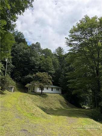 9.48 Acres of Land with Home for Sale in Lansing, North Carolina