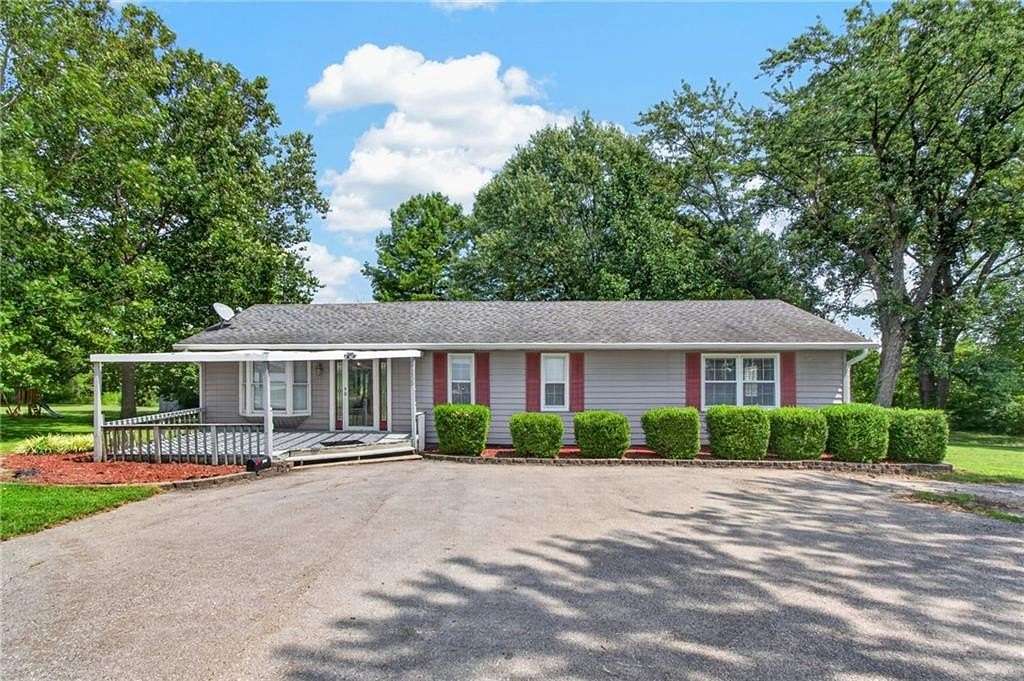 6.32 Acres of Land with Home for Sale in Peculiar, Missouri