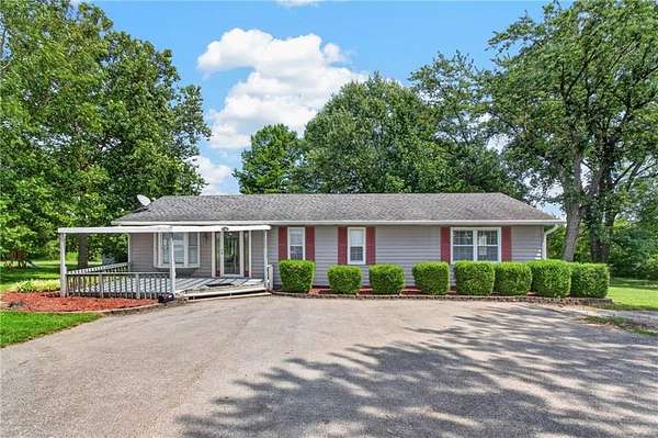 6.32 Acres of Land with Home for Sale in Peculiar, Missouri